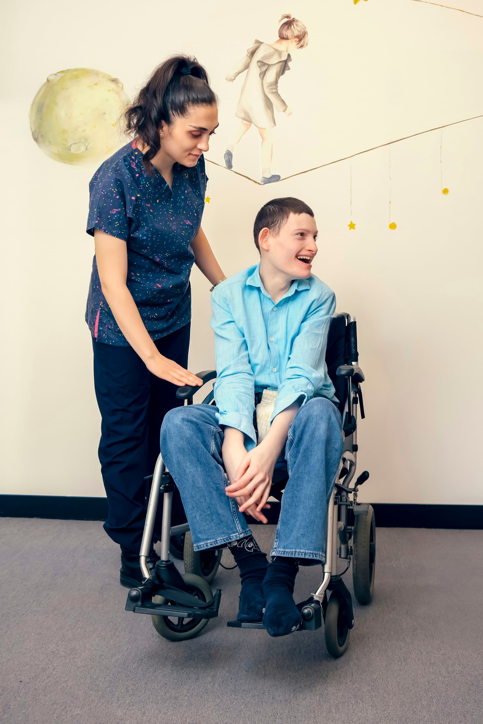 A caregiver sharing a warm, joyful moment with someone she supports