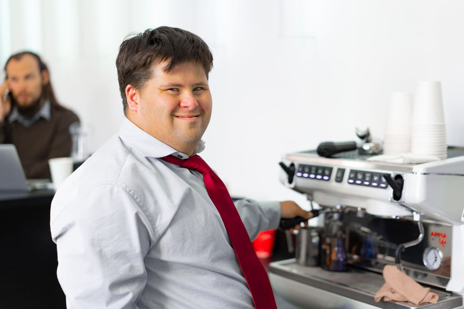A man practicing a foundational work skill at a coffee station